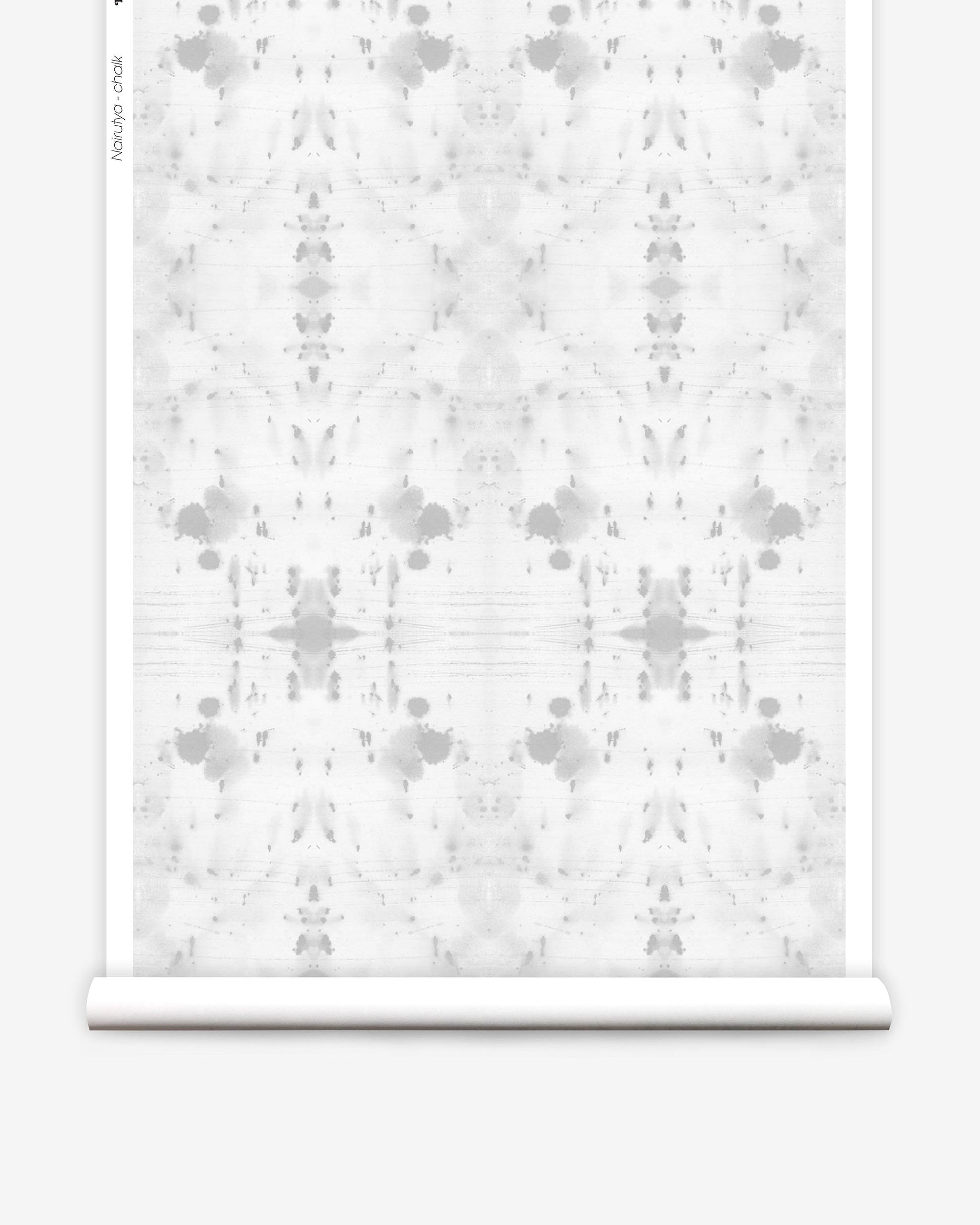 A roll of Nairutya Wallpaper with a white pattern on it