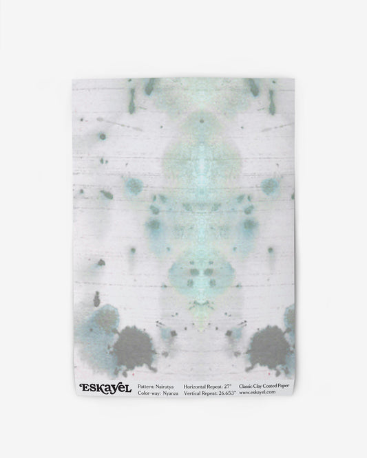 A Nairutya Wallpaper Sample Nyanza with a blue and green splatter on it
