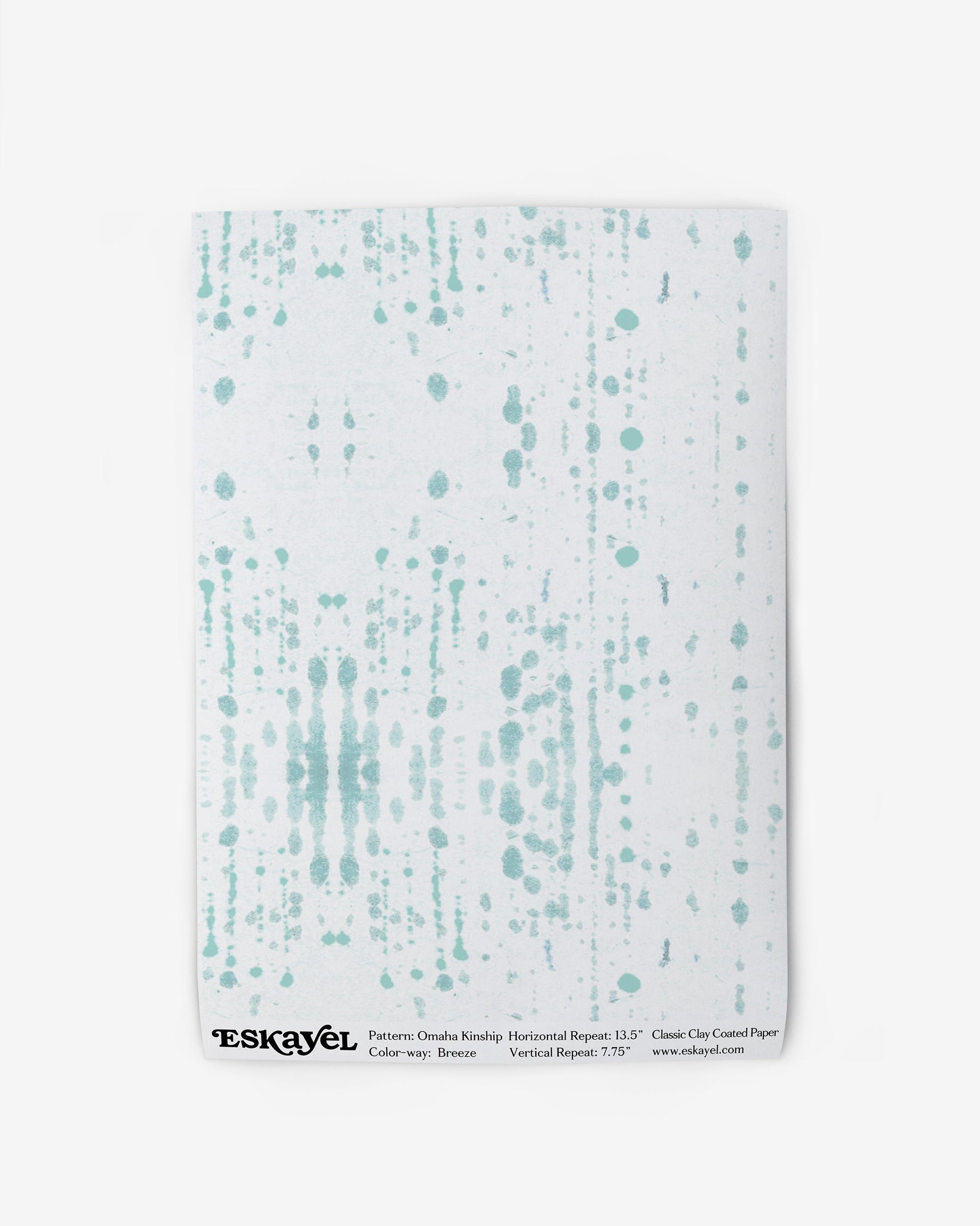 To a Omaha Kinship Wallpaper Sample Breeze, choose the white wallpaper with a green and white pattern on it