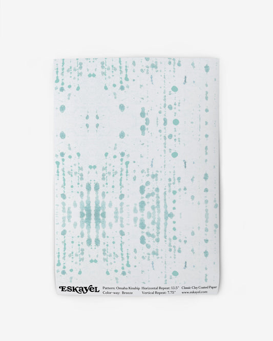 To a Omaha Kinship Wallpaper Sample Breeze, choose the white wallpaper with a green and white pattern on it