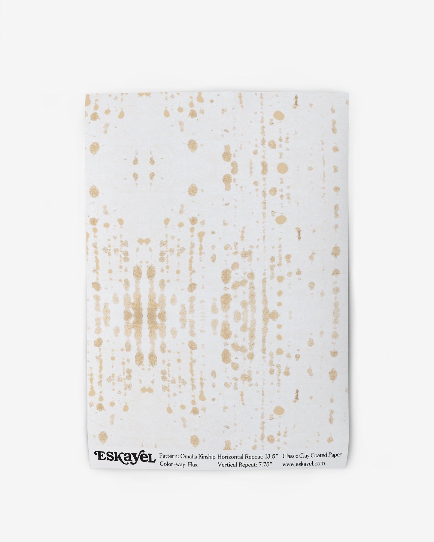 A white Omaha Kinship Wallpaper Flax with gold splatters on it