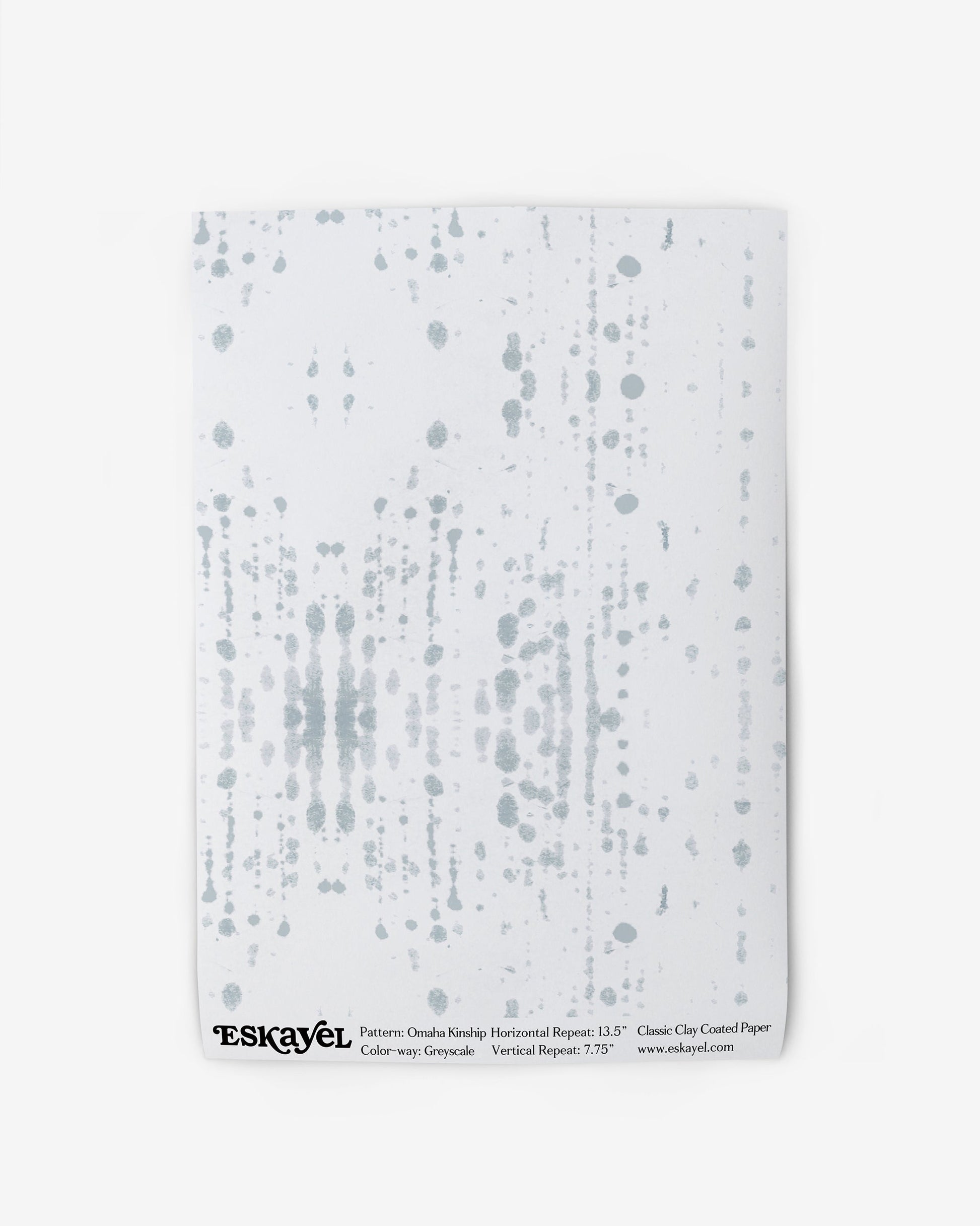 An Omaha Kinship Wallpaper Sample Grey with dots on it