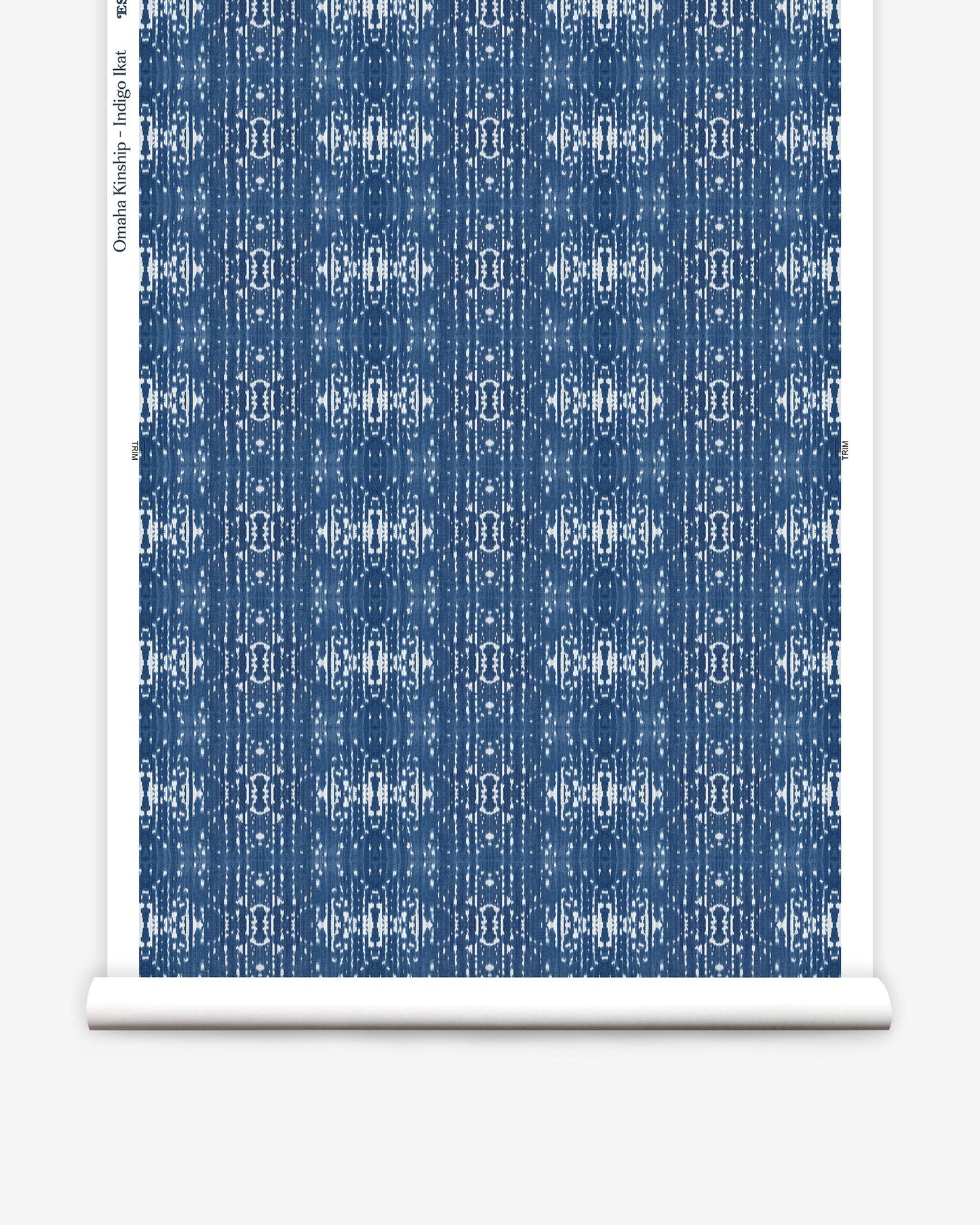A high-end pattern from Eskayel's Omaha Kinship Wallpaper on a roll of Indigo Ikat fabric