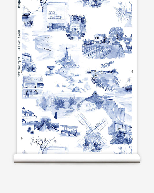 A roll of Out East Wallpaper Cobalt with blue and white toile pattern images on it