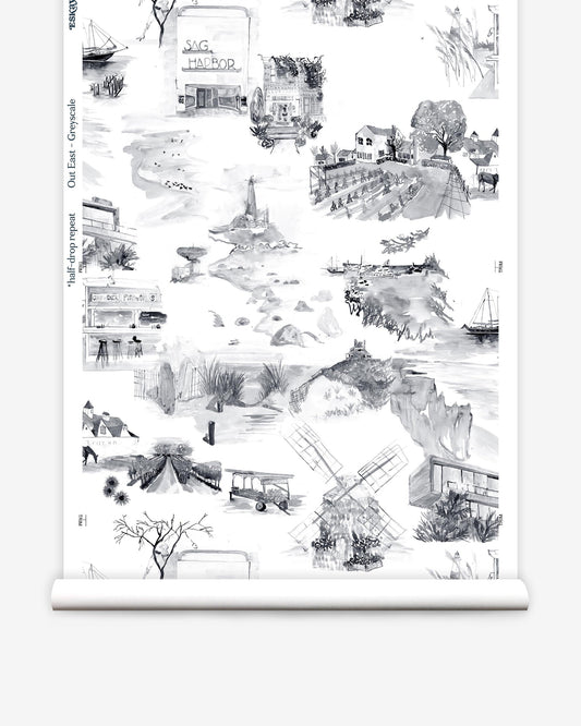 A roll of Out East Wallpaper Greyscale with black and white drawings, perfect for adding a touch of luxury to your space