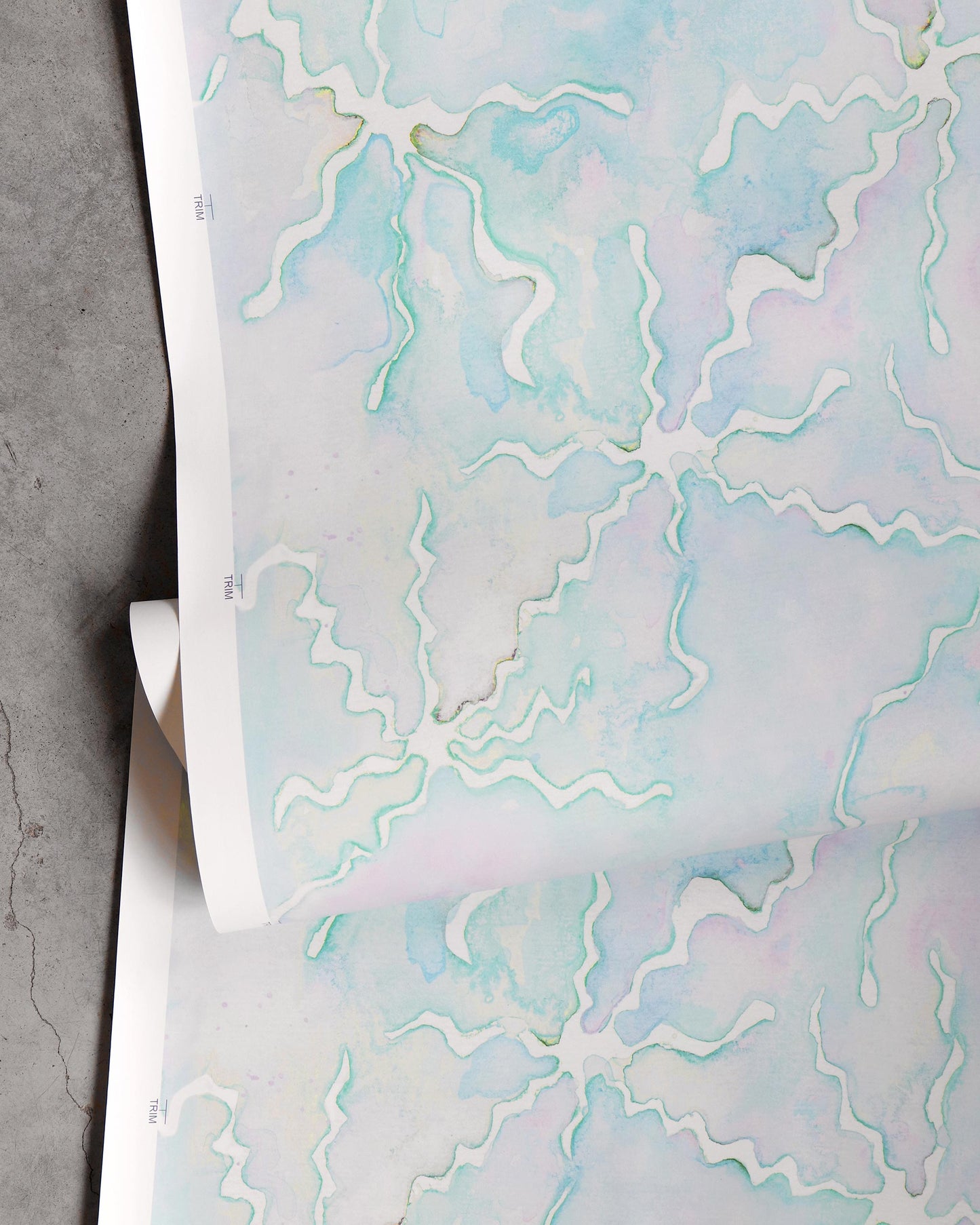 A Pecosa Wallpaper Brisa fabric design with a blue and white pattern