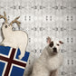 A dog is sitting next to a reindeer and a Polar Pedigree Wallpaper in greyscale