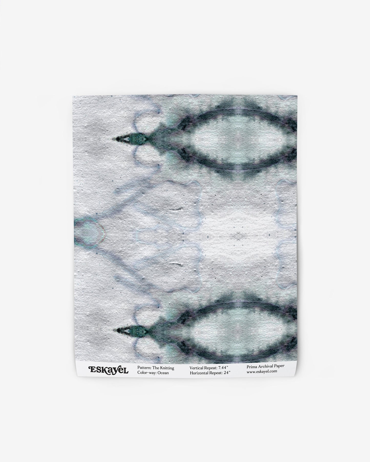 A wallpaper with a blue and white The Knitting Wallpaper Ocean colorway pattern on it
