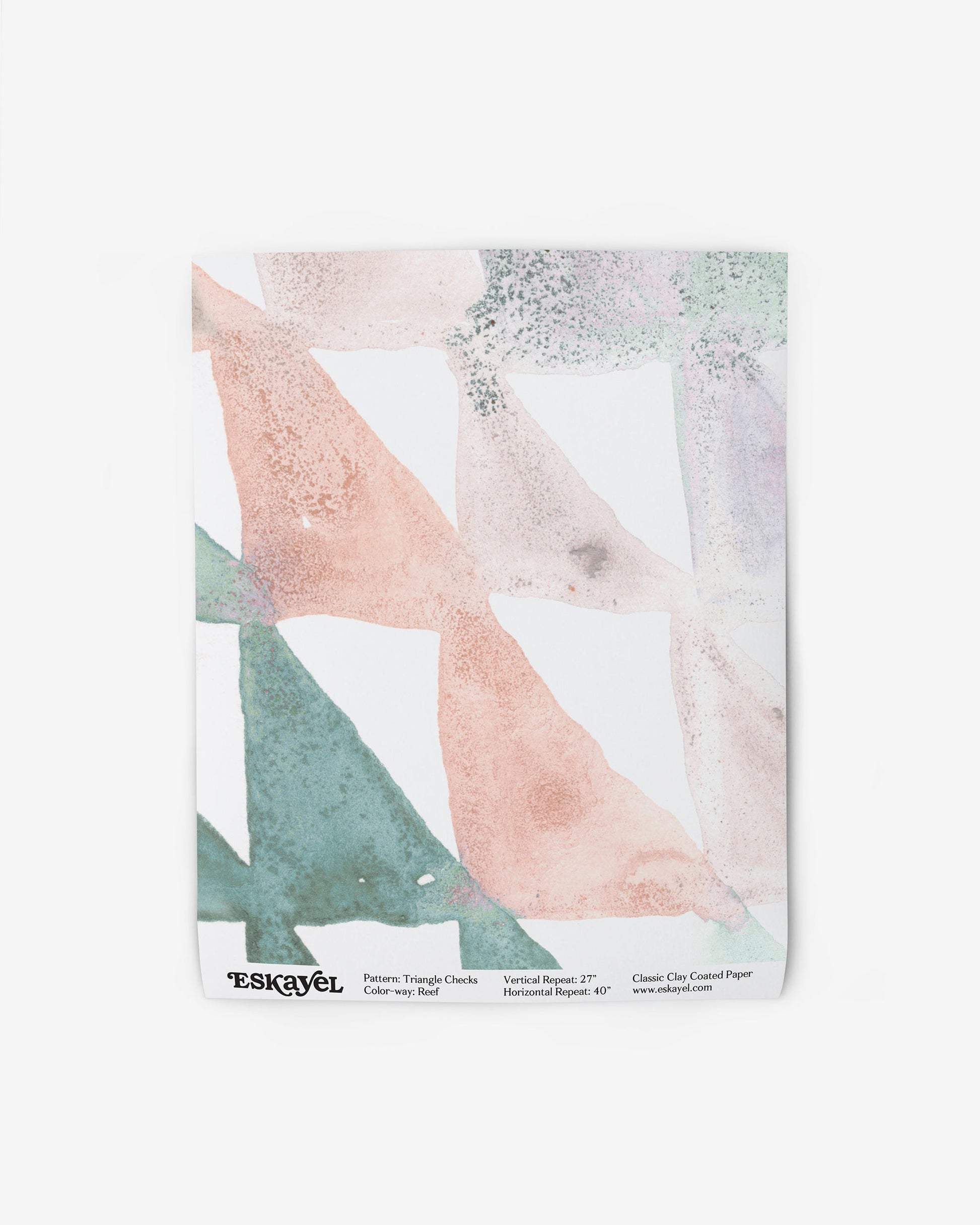 A white Triangle Checks Wallpaper Reef with a pink, green, and blue pattern