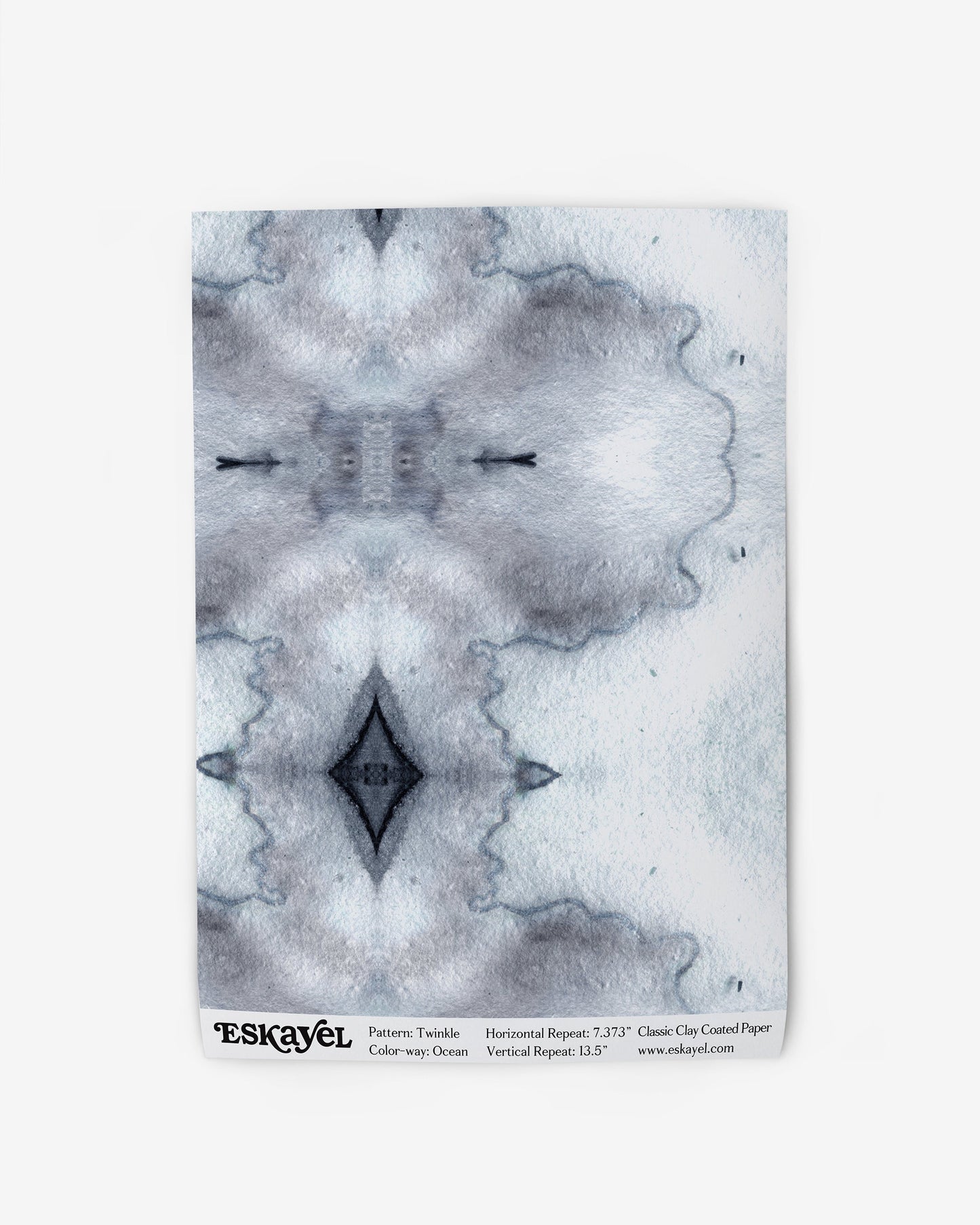 A notebook with a blue and white Twinkle Wallpaper Ocean design on it