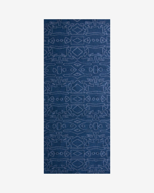 A blue flatweave rug with a graphic geometric pattern and an Akimbo 5 Flatweave Rug Indigo design
