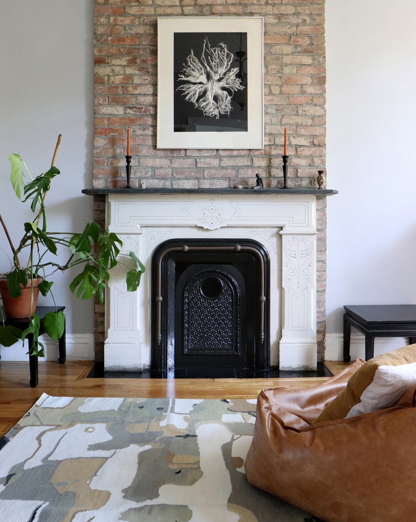 A living room with a fireplace, a bean bag chair, and a Medina Flatweave Rug