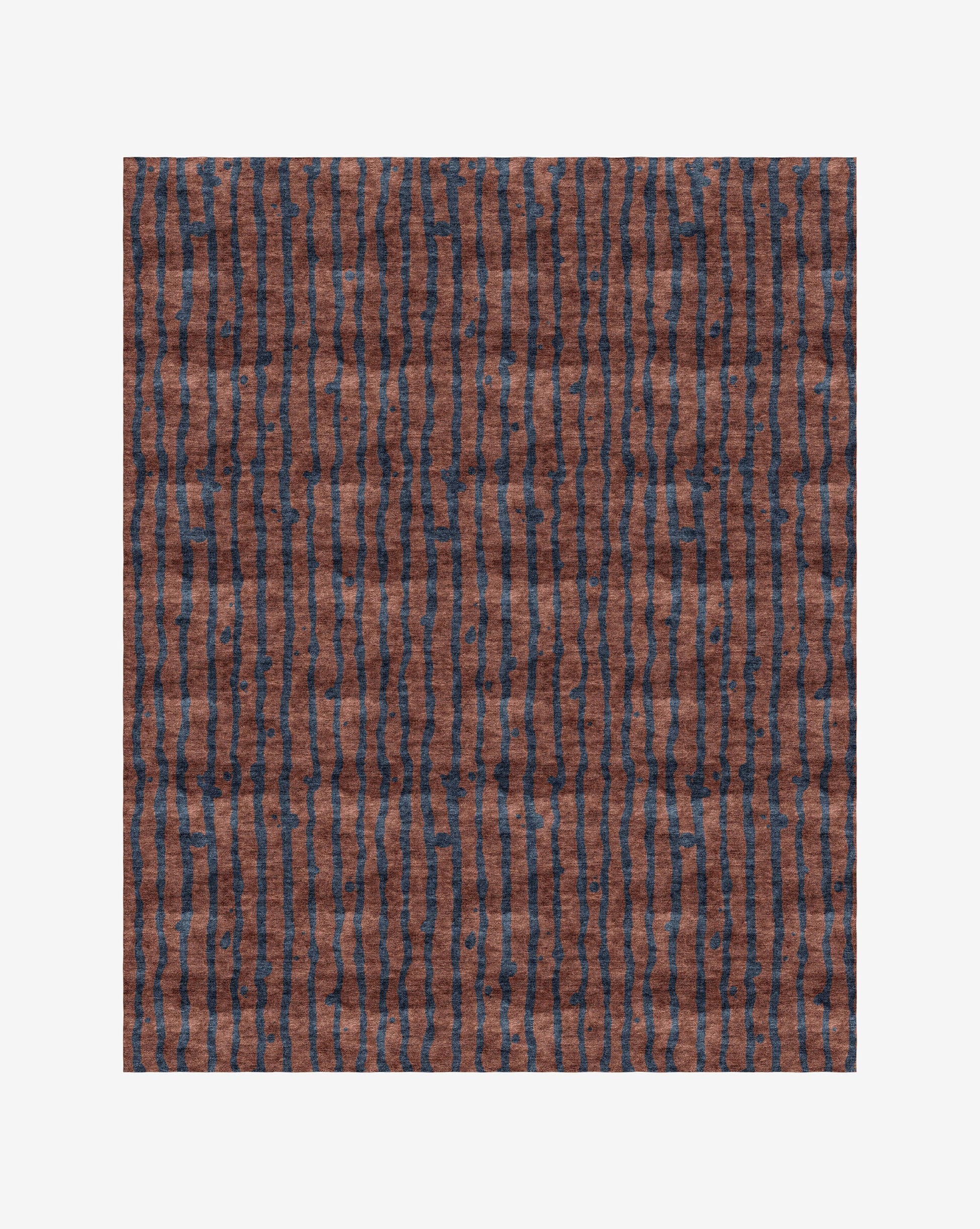 A Drippy Stripe Hand Knotted Rug Isthmus with a bold blue pattern