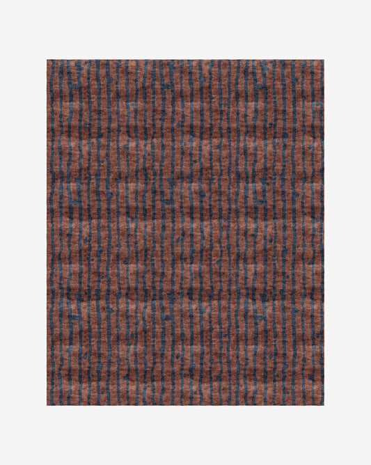 A Drippy Stripe Hand Knotted Rug Isthmus with a bold blue pattern