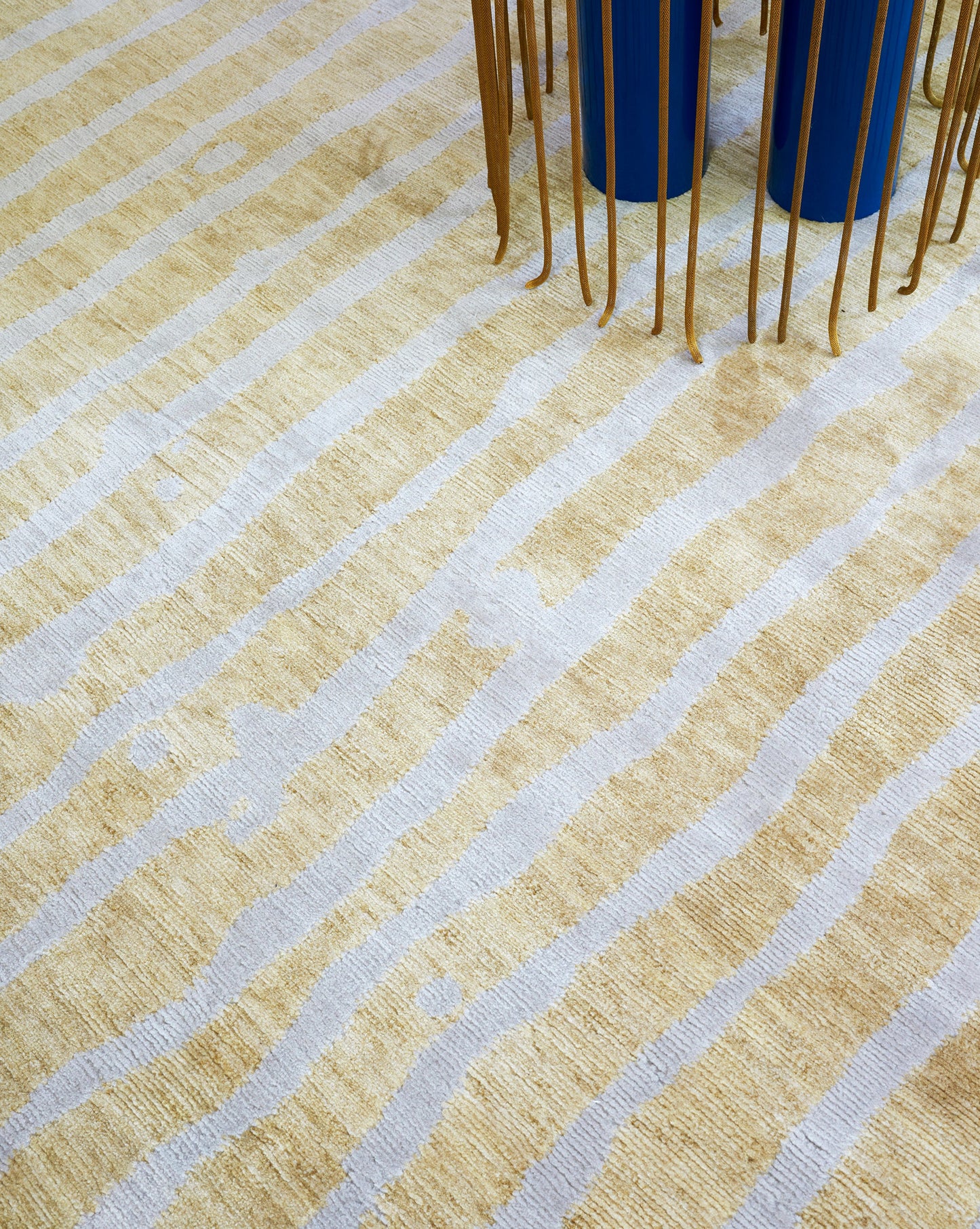 A Drippy Stripe Hand Knotted Rug Sage with bold contrasting colors