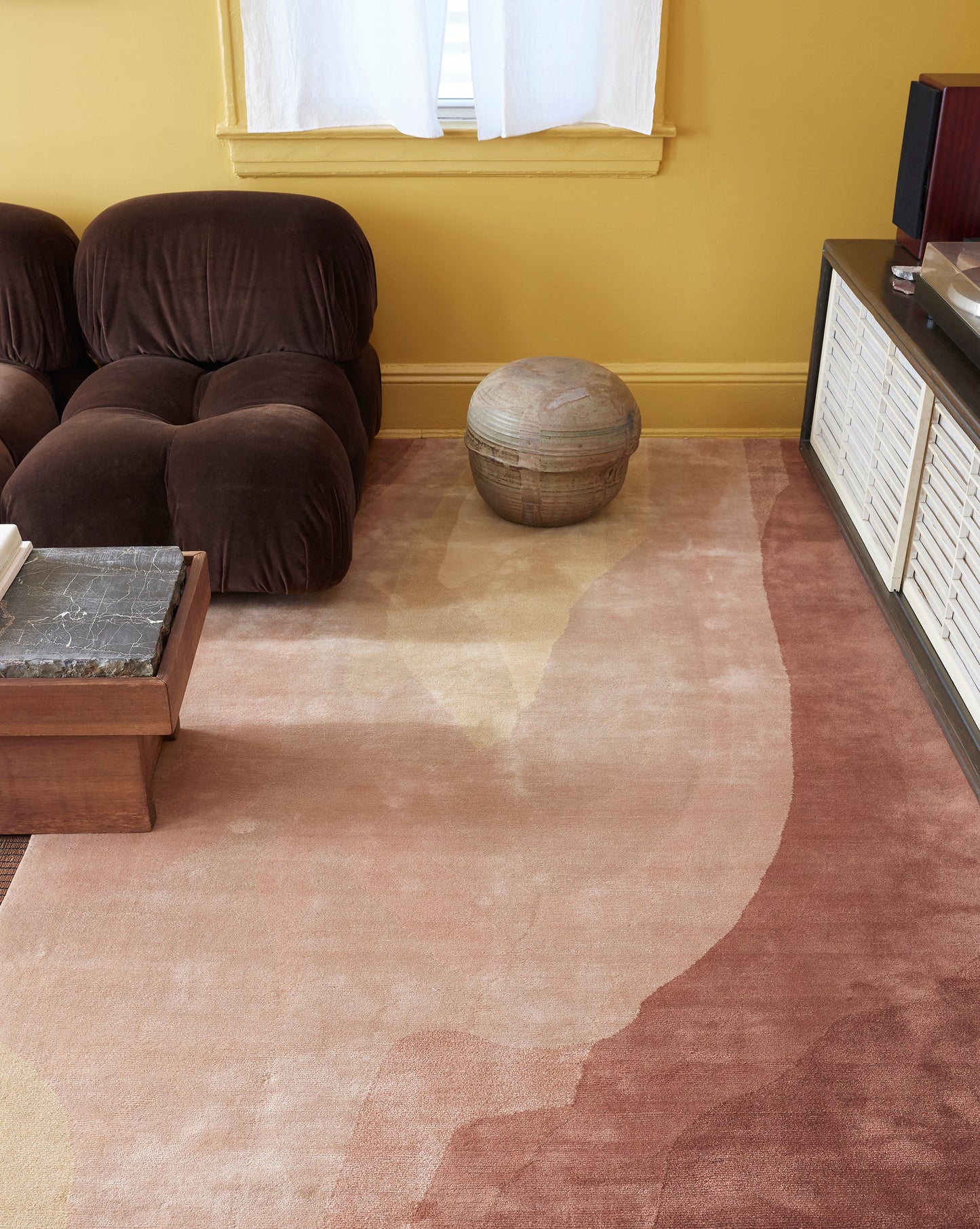 A living room with Light Sienna walls and a Progressions Hand Knotted Rug Light Sienna