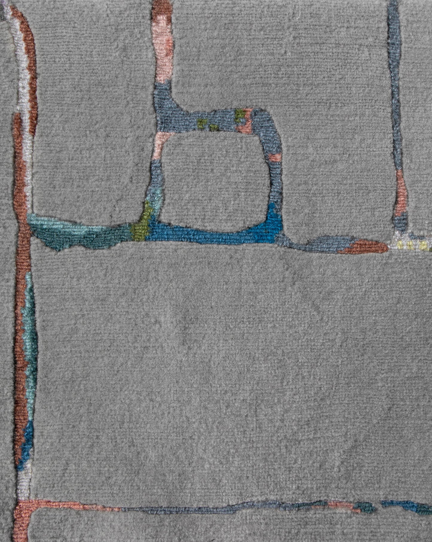 An abstract painting on a gray background with a Portico Hand Knotted Rug Greyscale Multi colorway