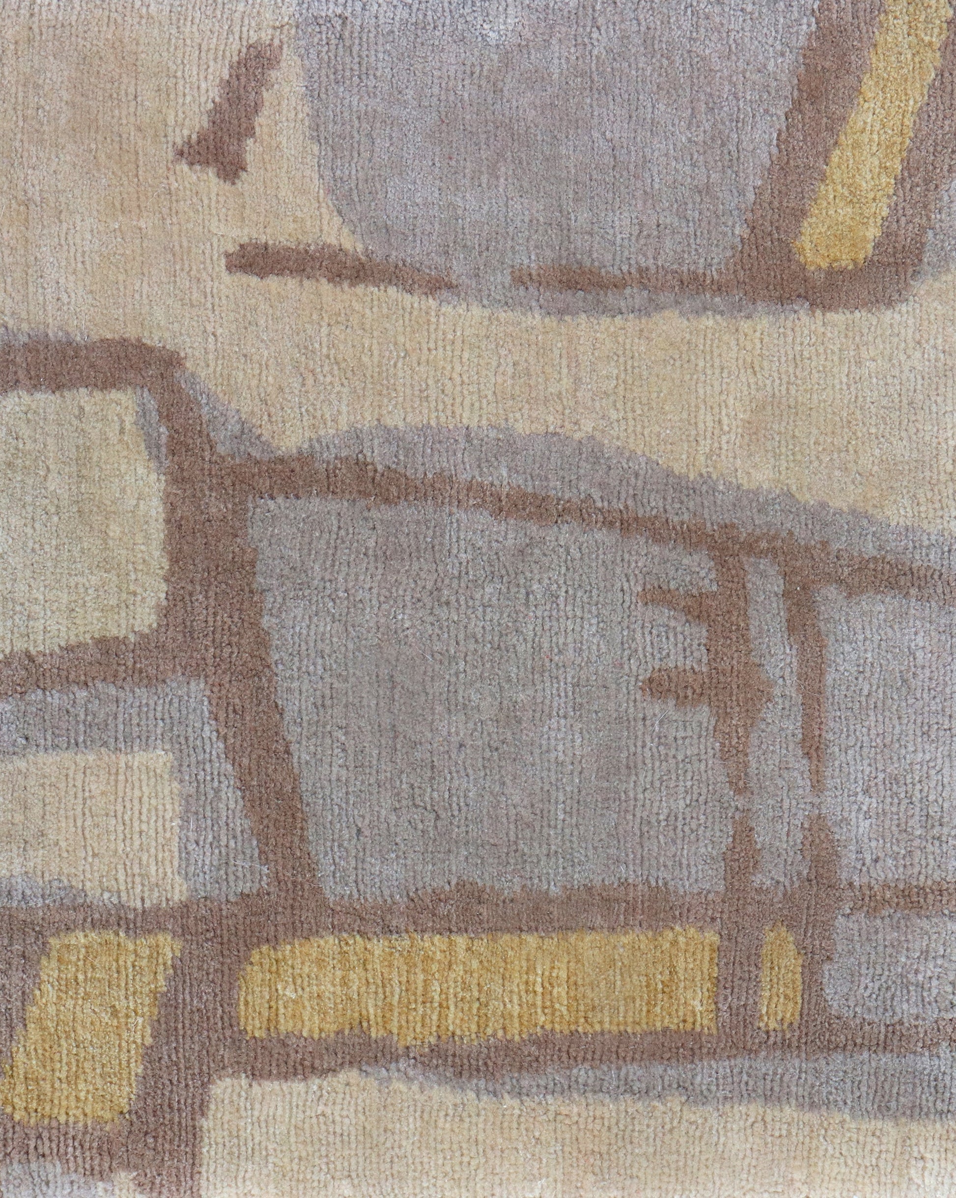 A yellow Quotidiana Hand Knotted Rug design with a beige and brown pattern