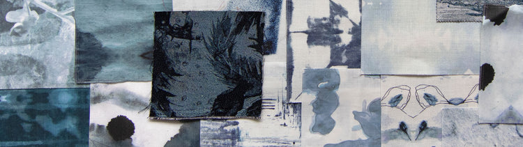 A collage of blue, black, and white pieces of paper.