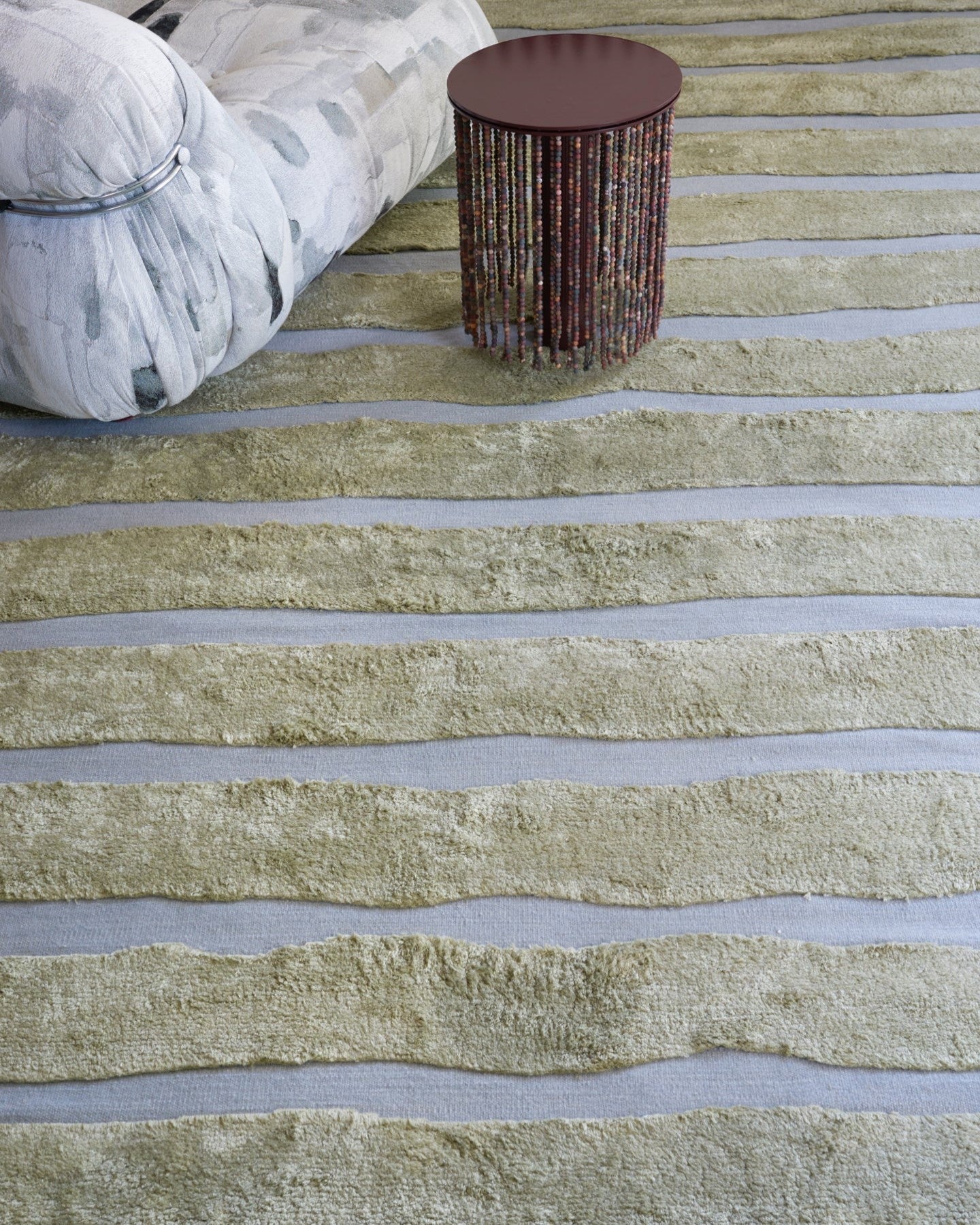 A living room with a rug on the floor