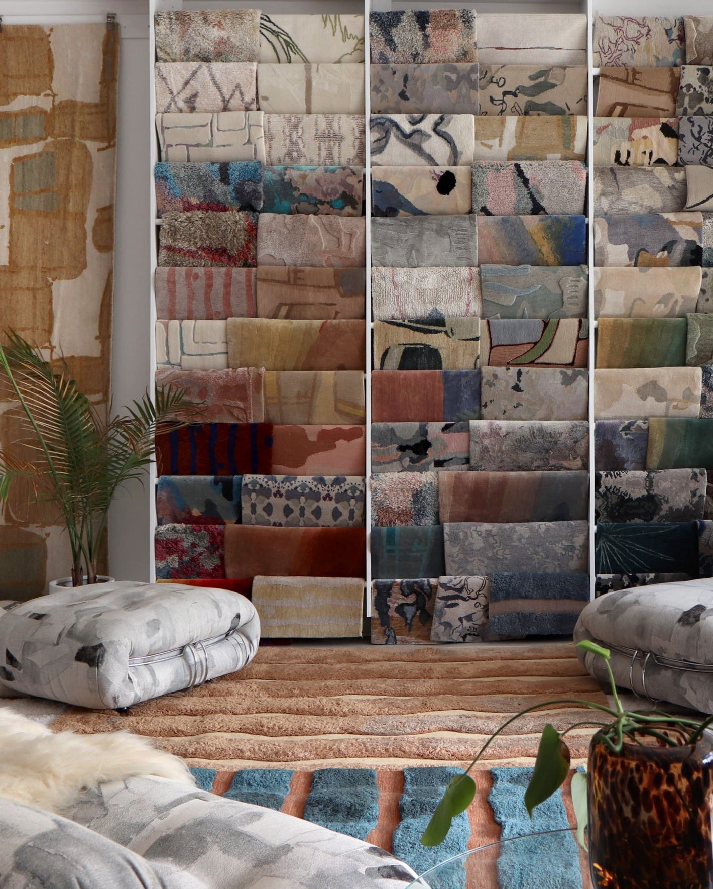 A room with a lot of rugs on the floor
