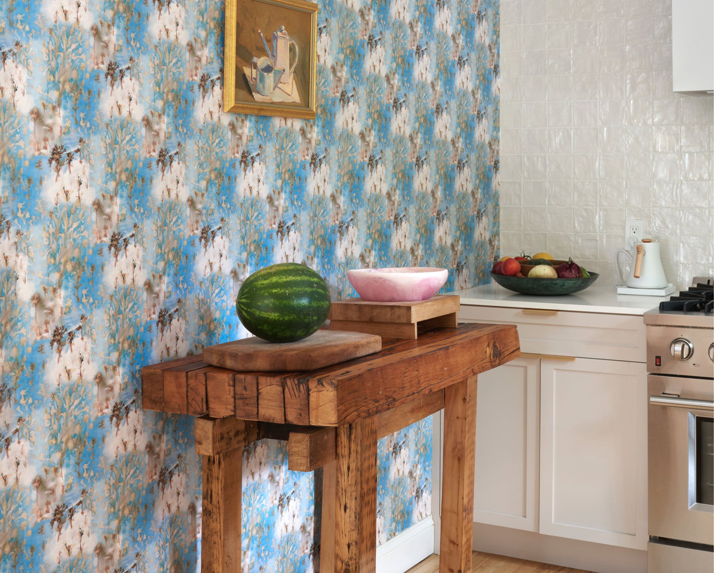 A blue and white wallpaper adorns the kitchen