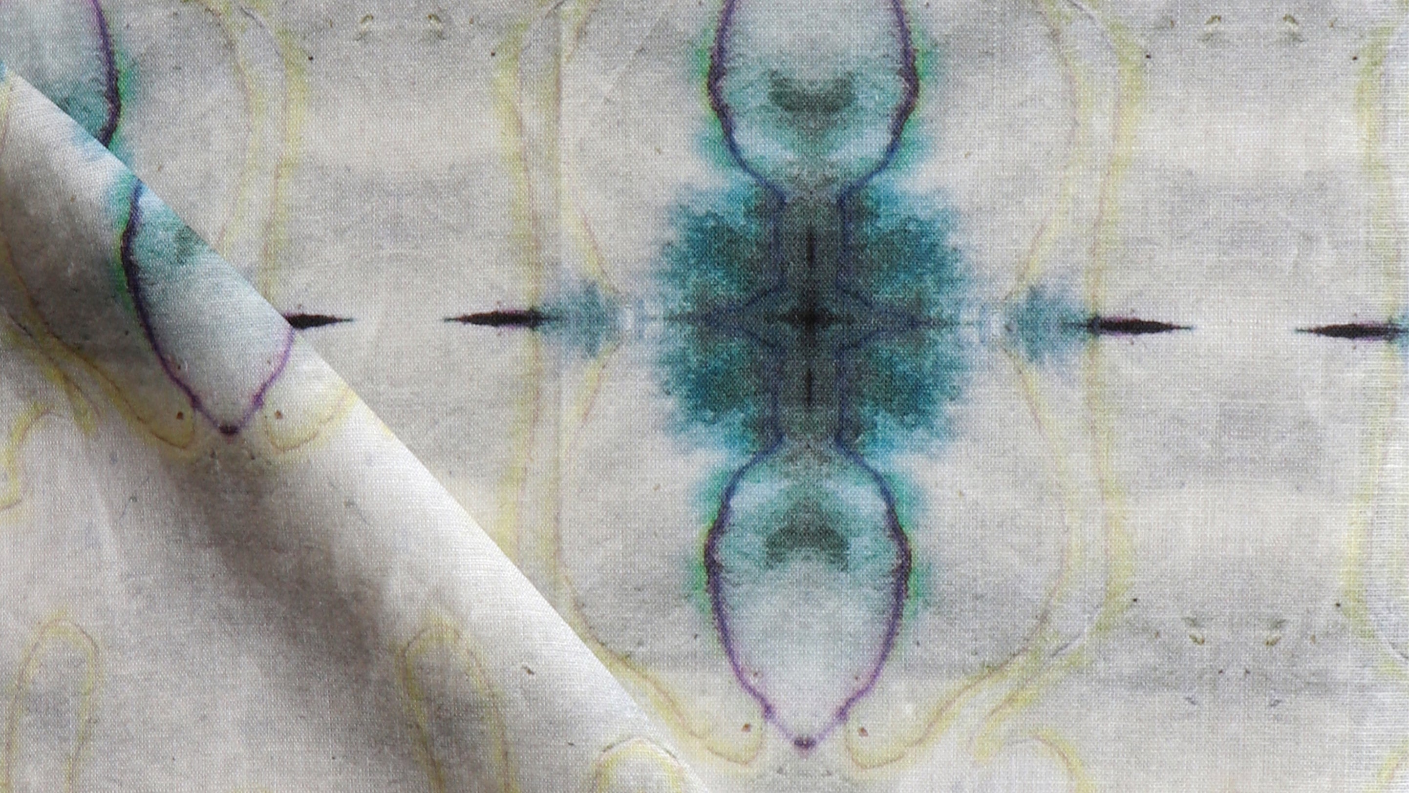 A close up of a fabric with a blue and green design