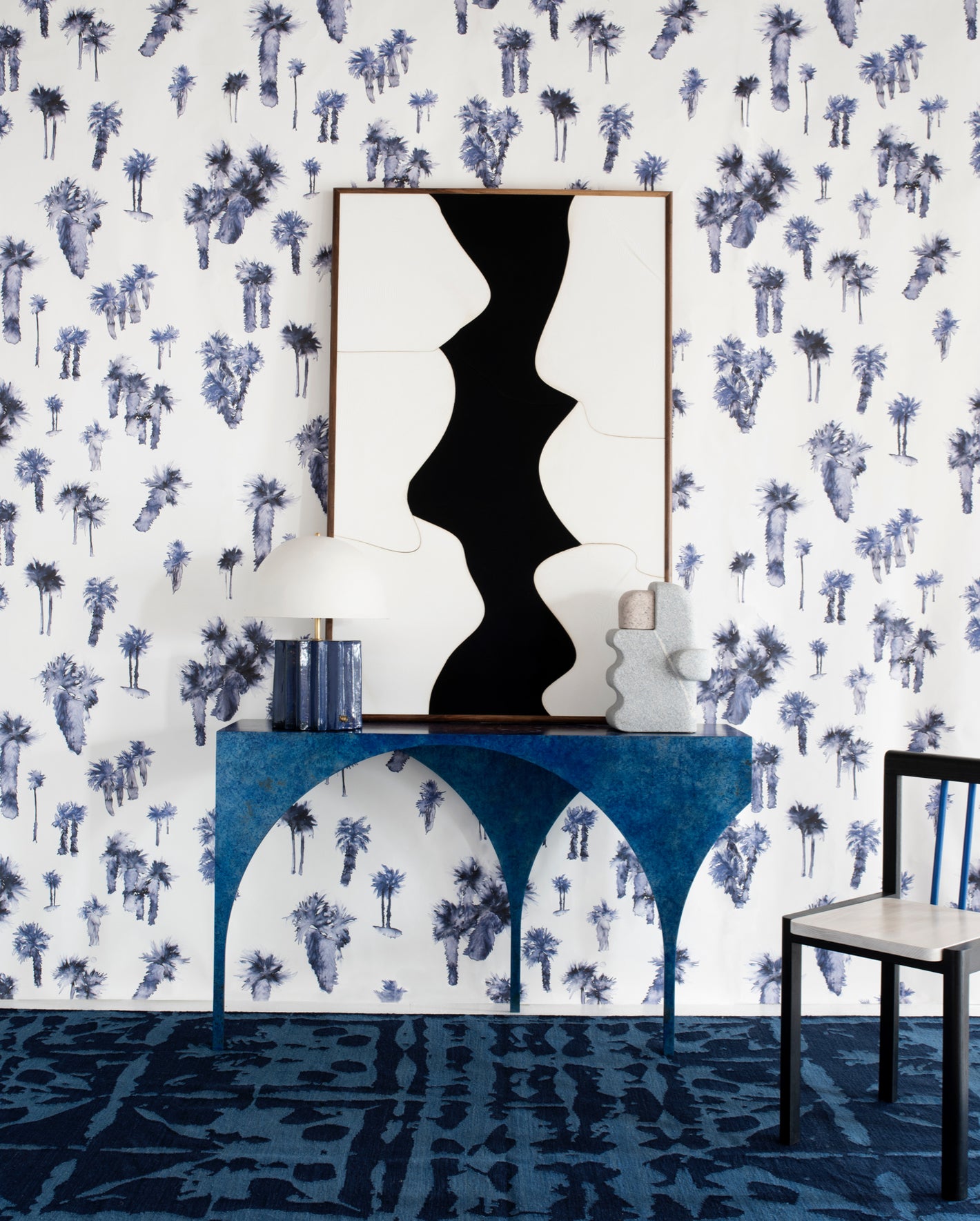 A blue and white wallpaper in a room
