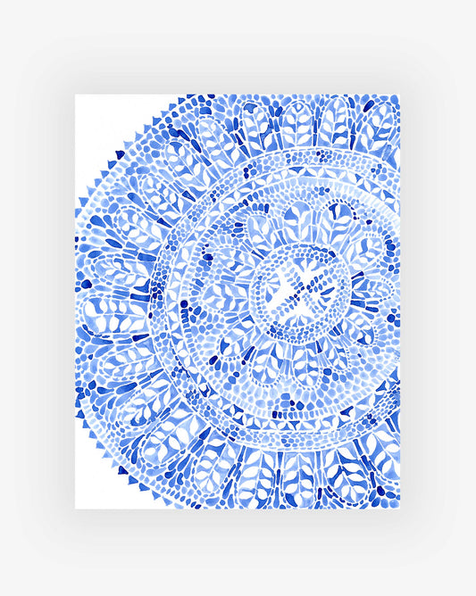 Blue and white circular botanical pattern on a white background