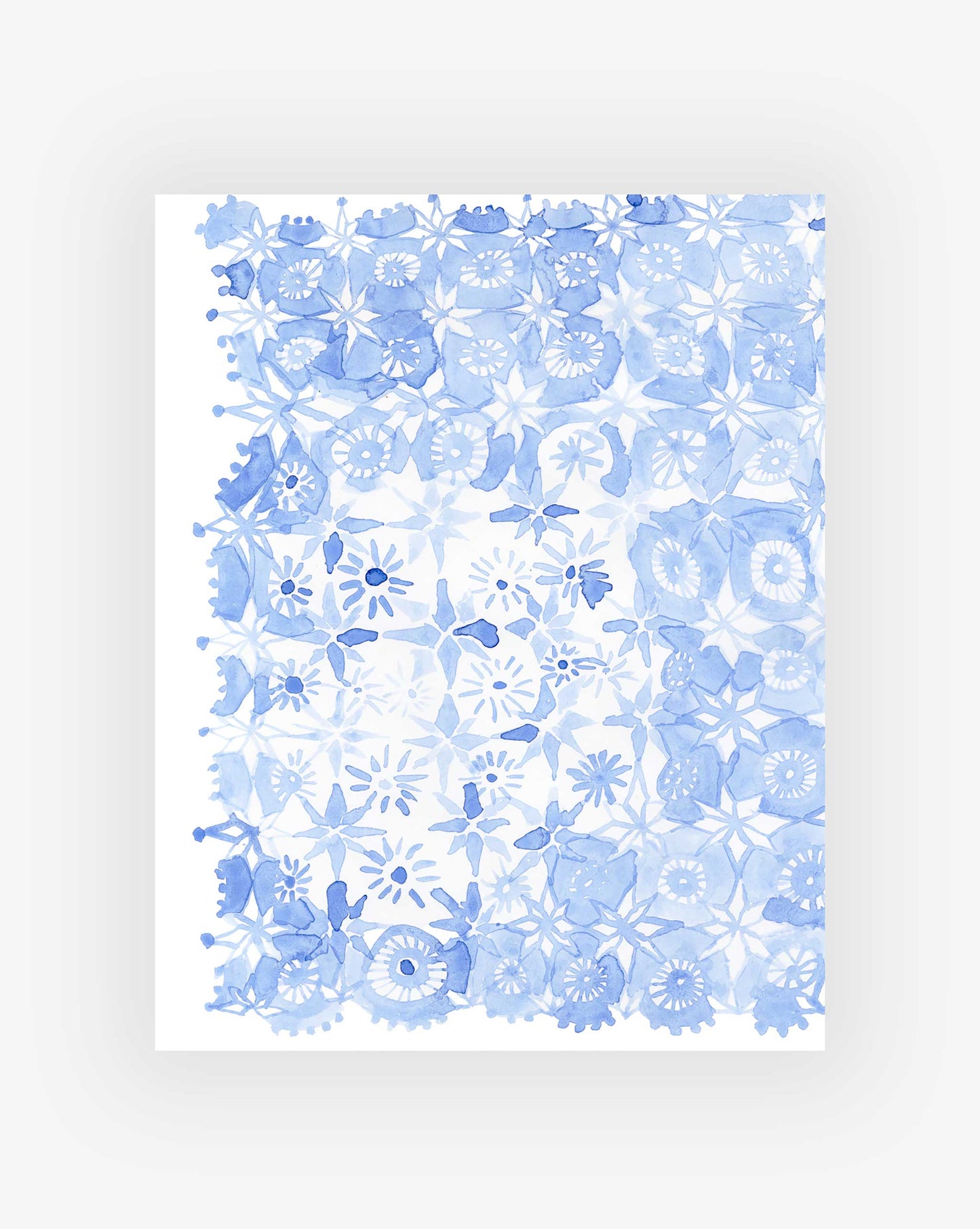 Crochet Lace Print by Eskayel, founded by Shanan Campanaro, showcases a grid of blue floral and geometric patterns on a white background in varying shades and densities.