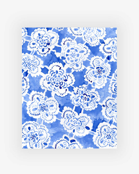 White floral pattern on a blue watercolor background.