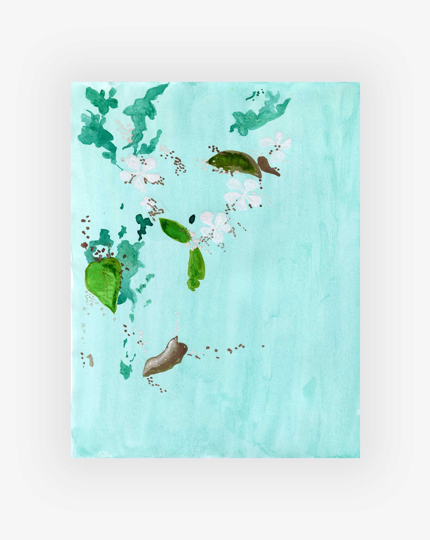 Foliage and flowers floating on a light blue background. 