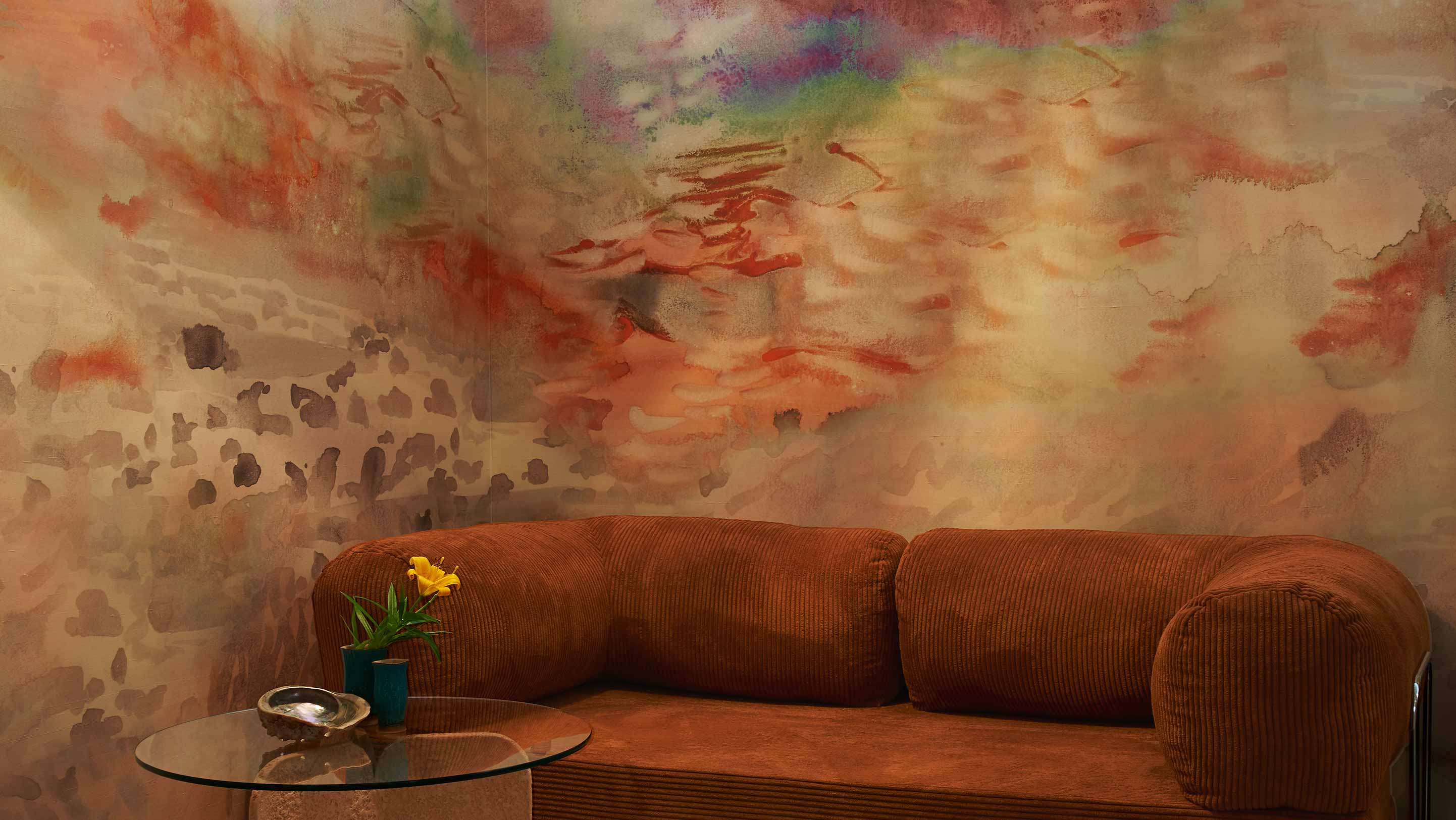 Eskayel's Empyrean Wallpaper Mural in the colorway Sol has an orange based multi colored hue.