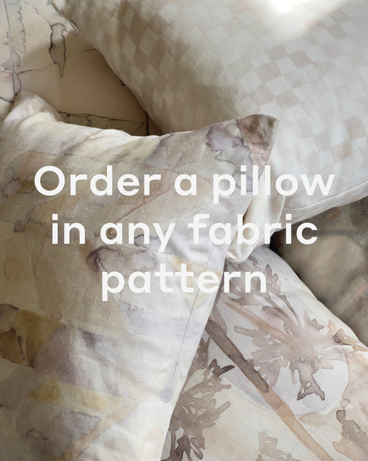 Custom Pillow products featuring abstract, checkered, and other fabric patterns are displayed together with the text "Order a Custom Pillow in any fabric pattern" overlaid.