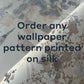 Close-up of silk fabric with floral wallpaper patterns, overlaid with text: "Order any Custom Silk Wallcovering or your own designs printed on our exclusive silk selection.