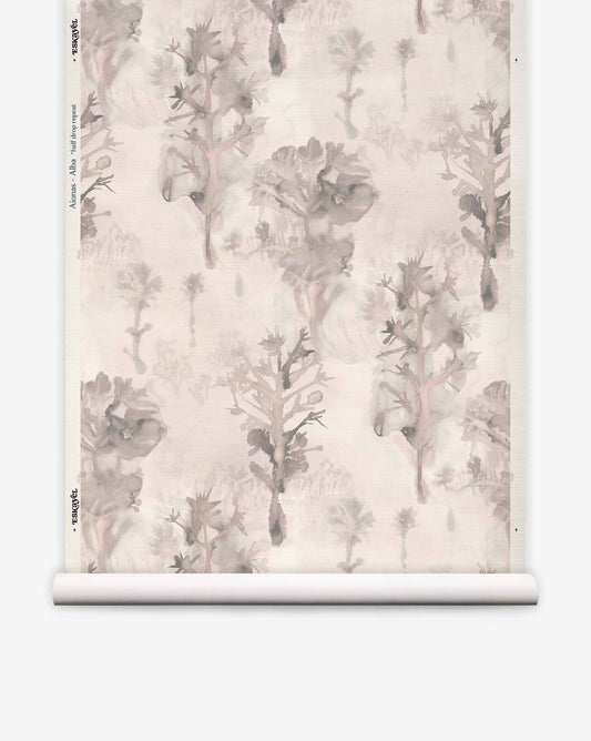 Aionas Grasscloth||Alba wallpaper roll featuring a beige hand-woven sisal grasscloth background with a repeating gray watercolor botanical print of stylized trees and organic-shaped flowers.