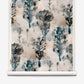 Aionas Grasscloth||Isthmus wallpaper featuring a repeating watercolor pattern of dark green and grey organic shapes on a textured, light-colored grasscloth background.