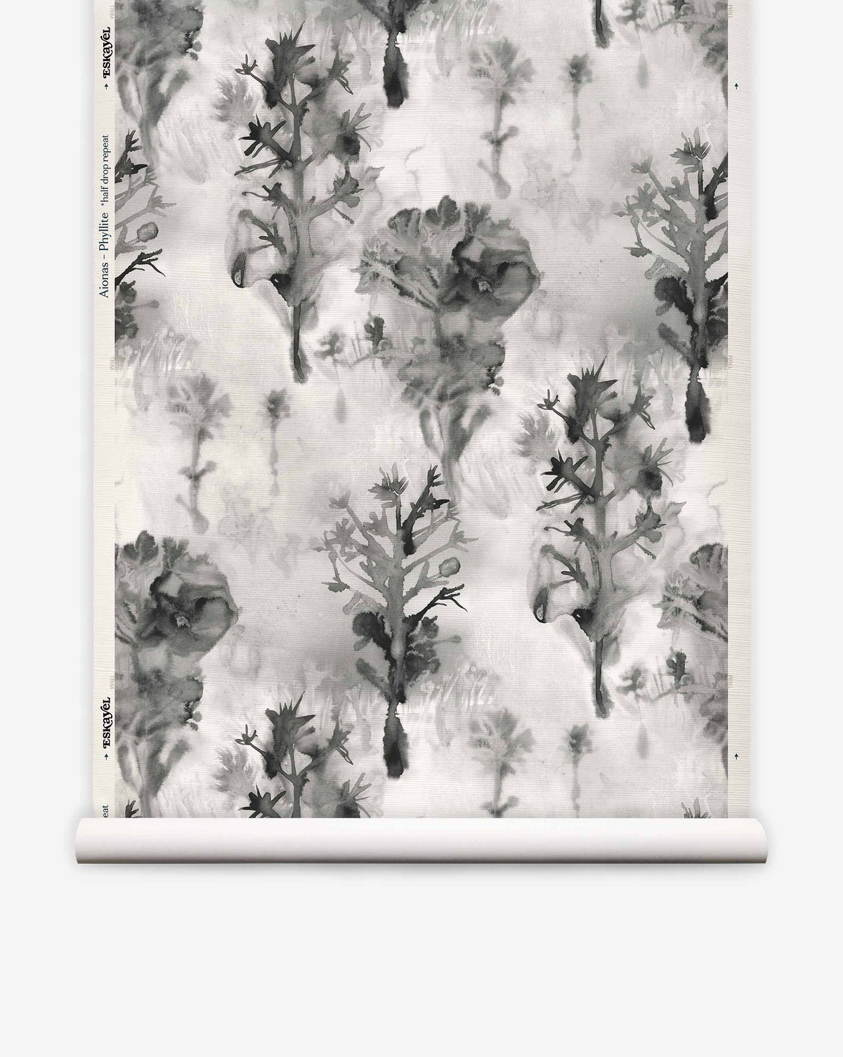 Aionas Grasscloth in Phyllite, featuring a grayscale watercolor pattern of stylized trees and flowers on textured sisal.