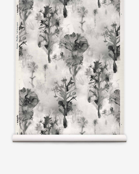 Aionas Grasscloth in Phyllite, featuring a grayscale watercolor pattern of stylized trees and flowers on textured sisal.