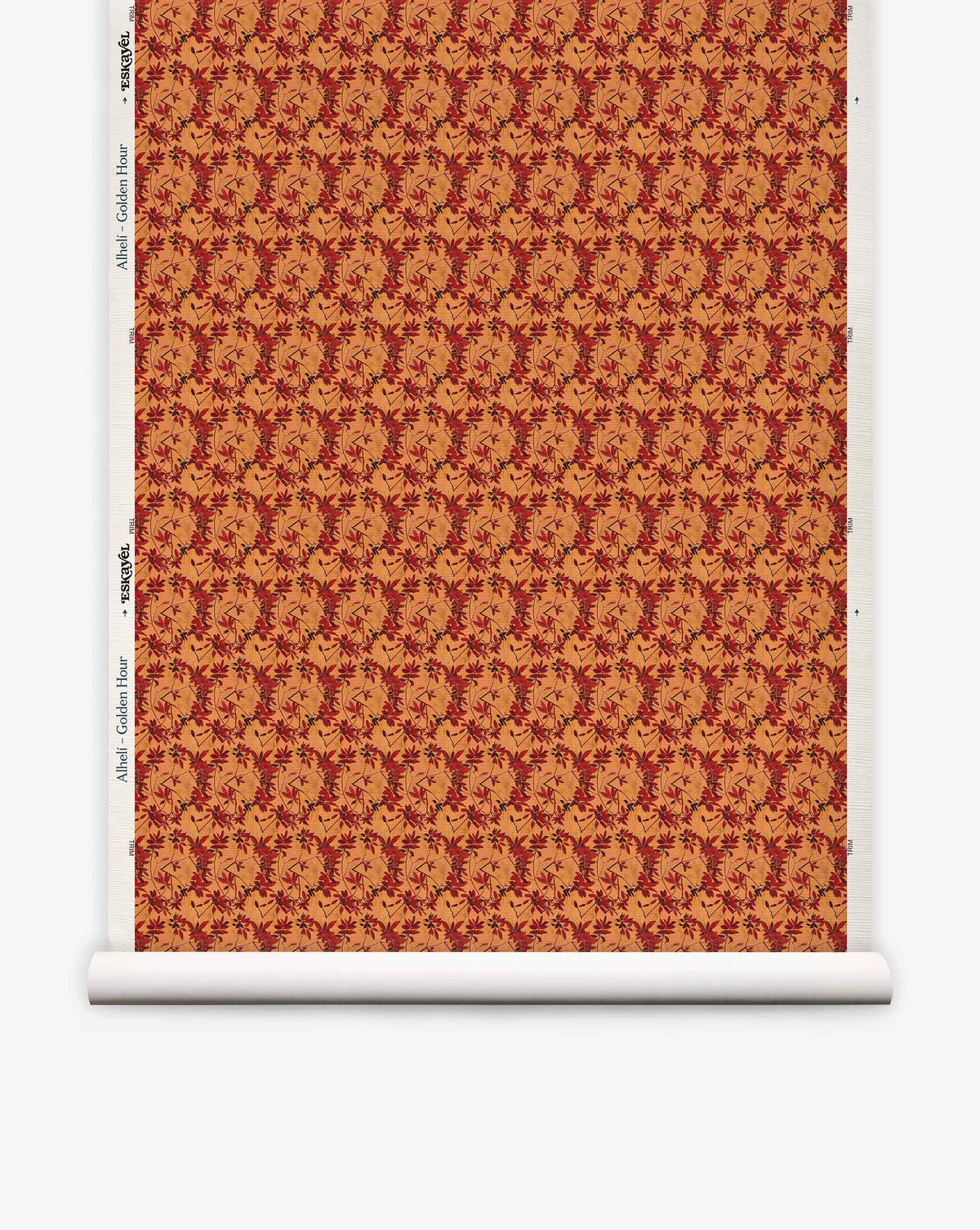Alhelí Grasscloth in Golden Hour featuring a hand-woven texture with a repeating pattern of dark red floral vines on a golden-orange background.