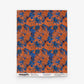 A rectangular swatch of Alhelí Grasscloth in Lobelia, an orange hand-woven wallpaper featuring a pattern of blue botanical silhouettes.