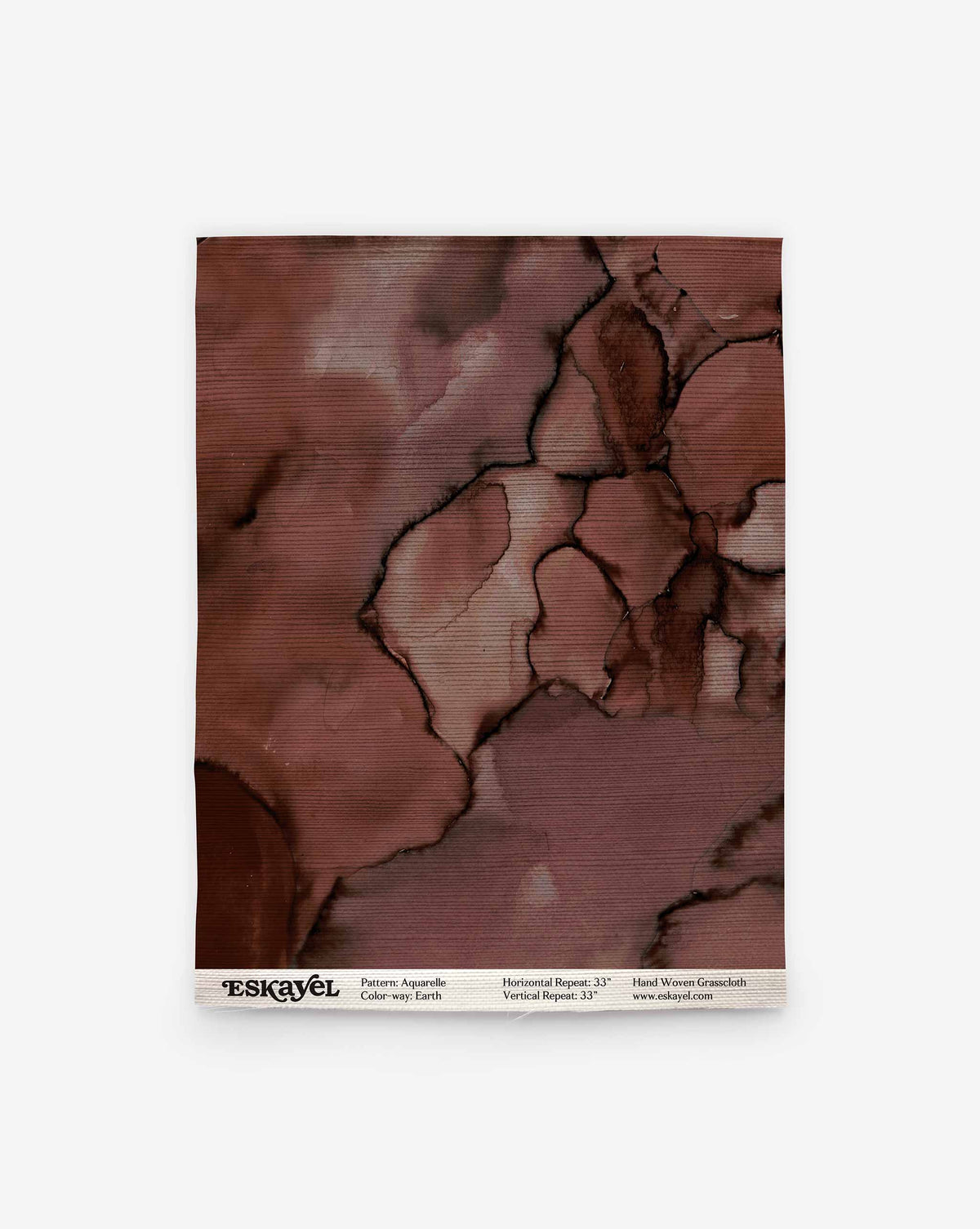 Aquarelle Grasscloth Sample in Earth, featuring a deep brown, abstract ink-wash pattern on grasscloth wallpaper.