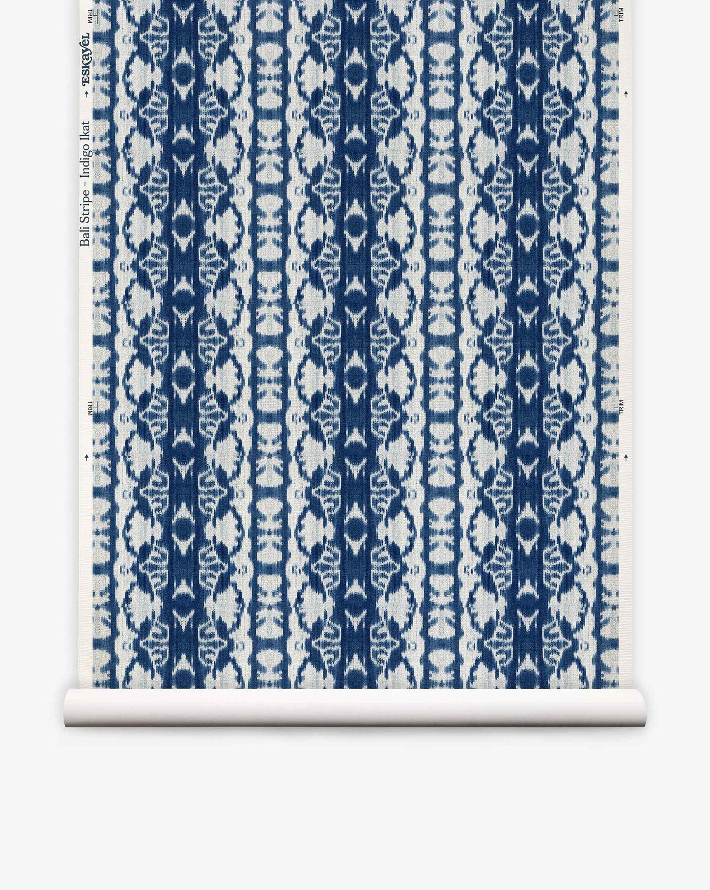 Bali Stripe Grasscloth||Indigo Ikat is a blue and white wallpaper roll featuring a repeating floral and geometric pattern in vertical stripes on a white background, inspired by indigo ikat for an abstract aesthetic.