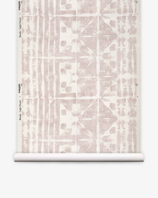 A roll of Banda Grasscloth||Light Peach custom wallpaper featuring a light peach abstract geometric pattern on a white background, displayed vertically against a white surface.