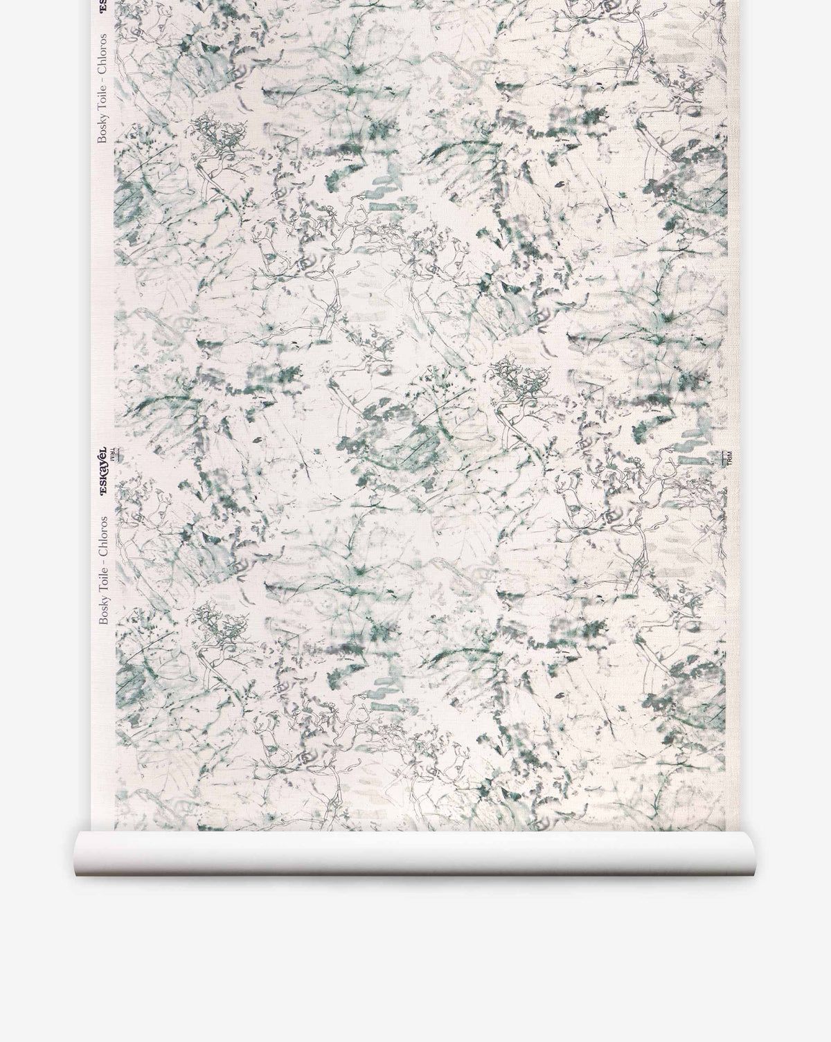 A roll of Bosky Toile Grasscloth in Chloros, featuring an abstract, dark green ink-wash design of layered branches and foliage on a textured cream background.