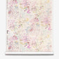Bosky Toile Grasscloth||Polychrome luxury watercolor wallpaper featuring abstract painterly splashes and fine, sprawling branches in pink, blue, and yellow on a cream-colored textured background.