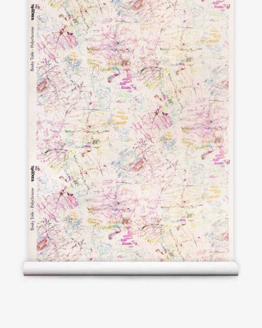 Bosky Toile Grasscloth||Polychrome luxury wallpaper featuring an abstract botanical pattern in shades of pink, yellow, blue, and black on a textured cream background.
