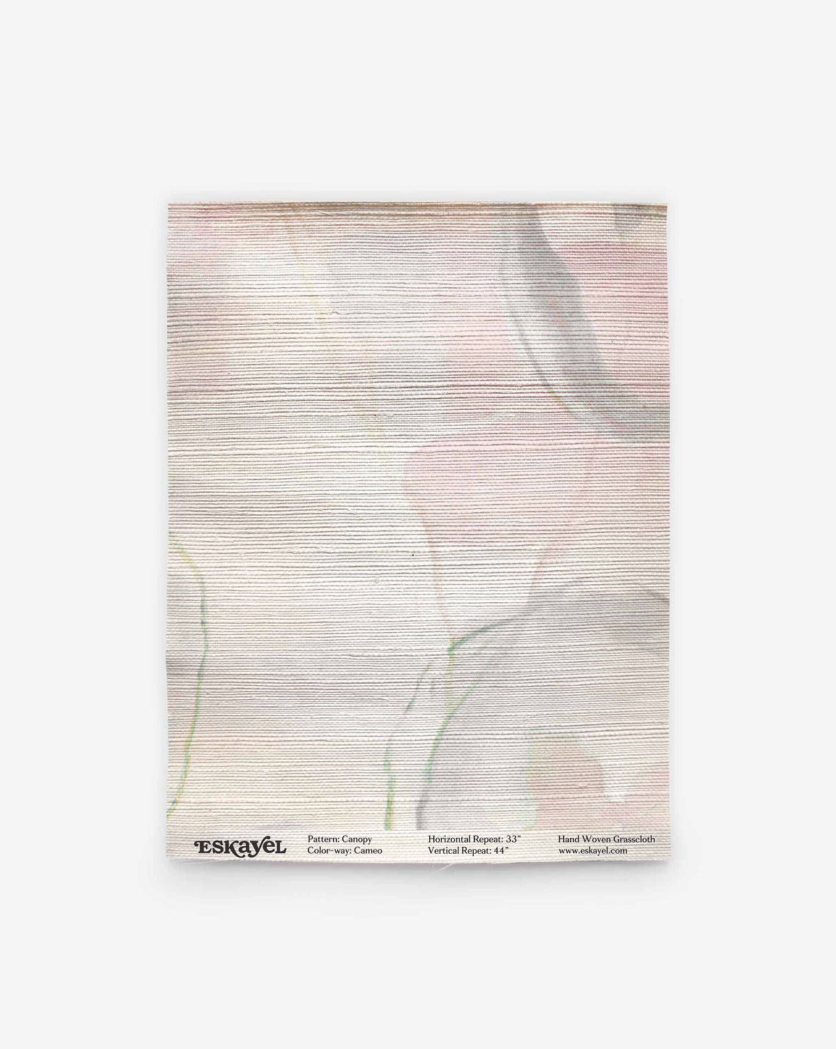 A rectangular Canopy Grasscloth Sample in Cameo, featuring textured grasscloth with a soft, abstract watercolor pattern in pink, grey, and green, with a product label at the bottom.