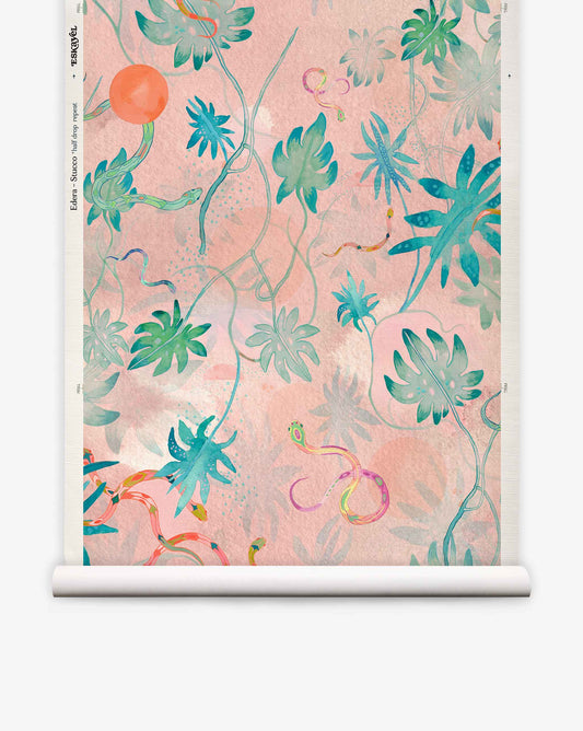 Introducing Edera Grasscloth||Stucco: a pastel pink wallpaper featuring a botanical pattern of green and blue tropical leaves with thin, winding vines reminiscent of ivy, accented by orange and yellow highlights—a fresh interpretation of modern chinoiserie wallpaper.