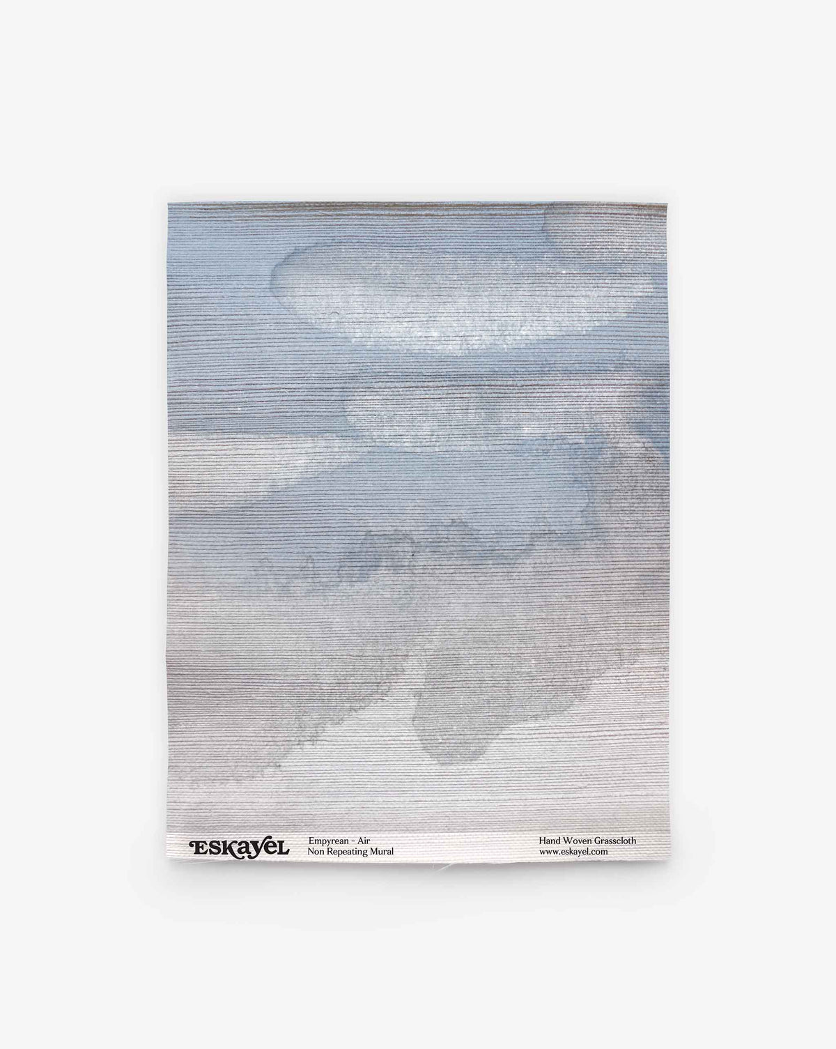The Empyrean Grasscloth Sample||Air showcases a square textile with a woven abstract pattern of gray and blue clouds. Branding and website details are printed along the bottom edge. Order a sample to experience its unique texture and artistry firsthand.